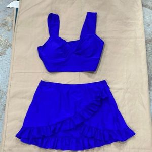 Blue 3 piece with bikini bottom and skirt, never worn